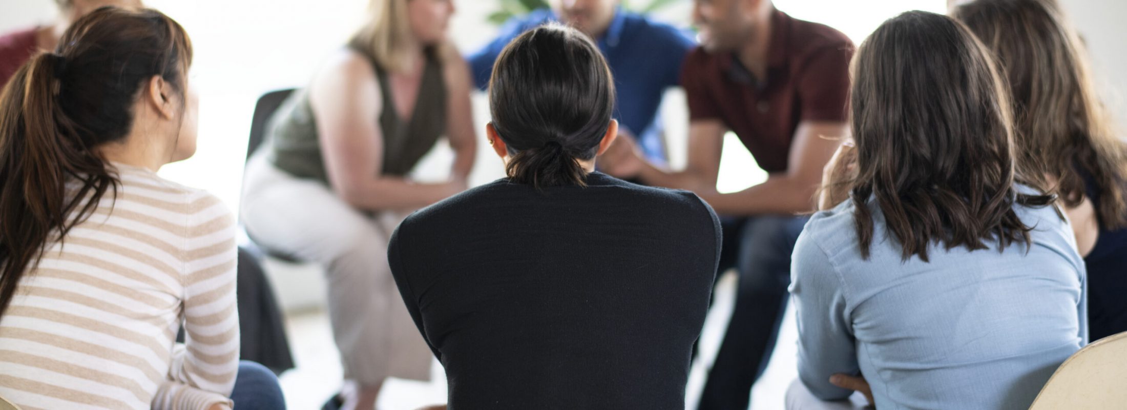 Diverse people in a supporting group session