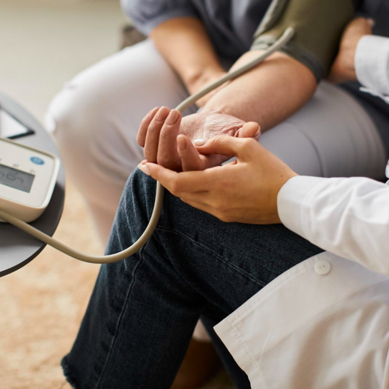 high-angle-covid-recovery-center-female-doctor-checking-elder-patient-s-blood-pressure-1920x1021