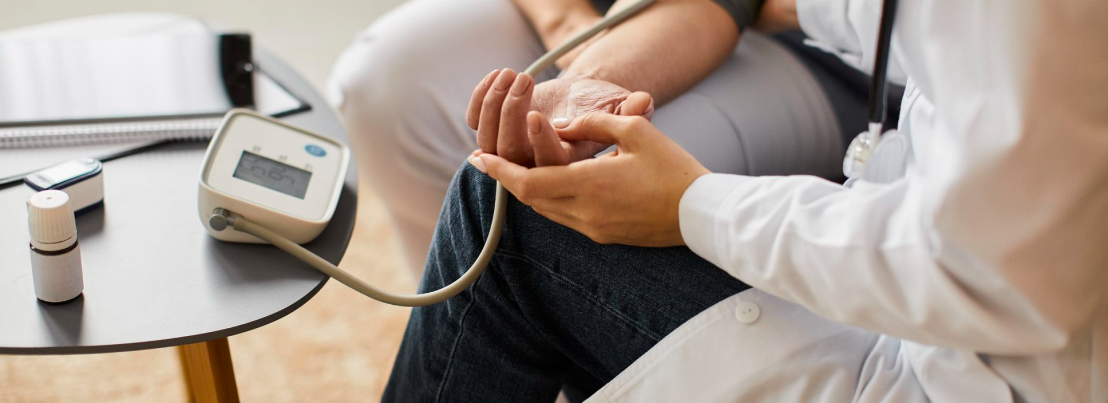 high-angle-covid-recovery-center-female-doctor-checking-elder-patient-s-blood-pressure-1920x1021